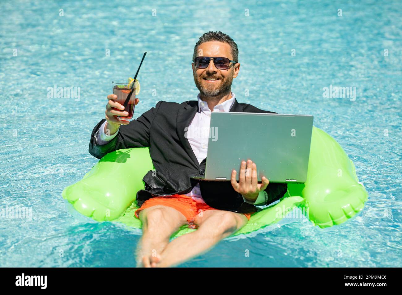https://c8.alamy.com/comp/2PM9MC6/summer-business-dreams-millennial-business-man-in-suit-floating-with-cocktail-and-laptop-in-swimming-pool-summer-vacation-funny-crazy-businessman-2PM9MC6.jpg