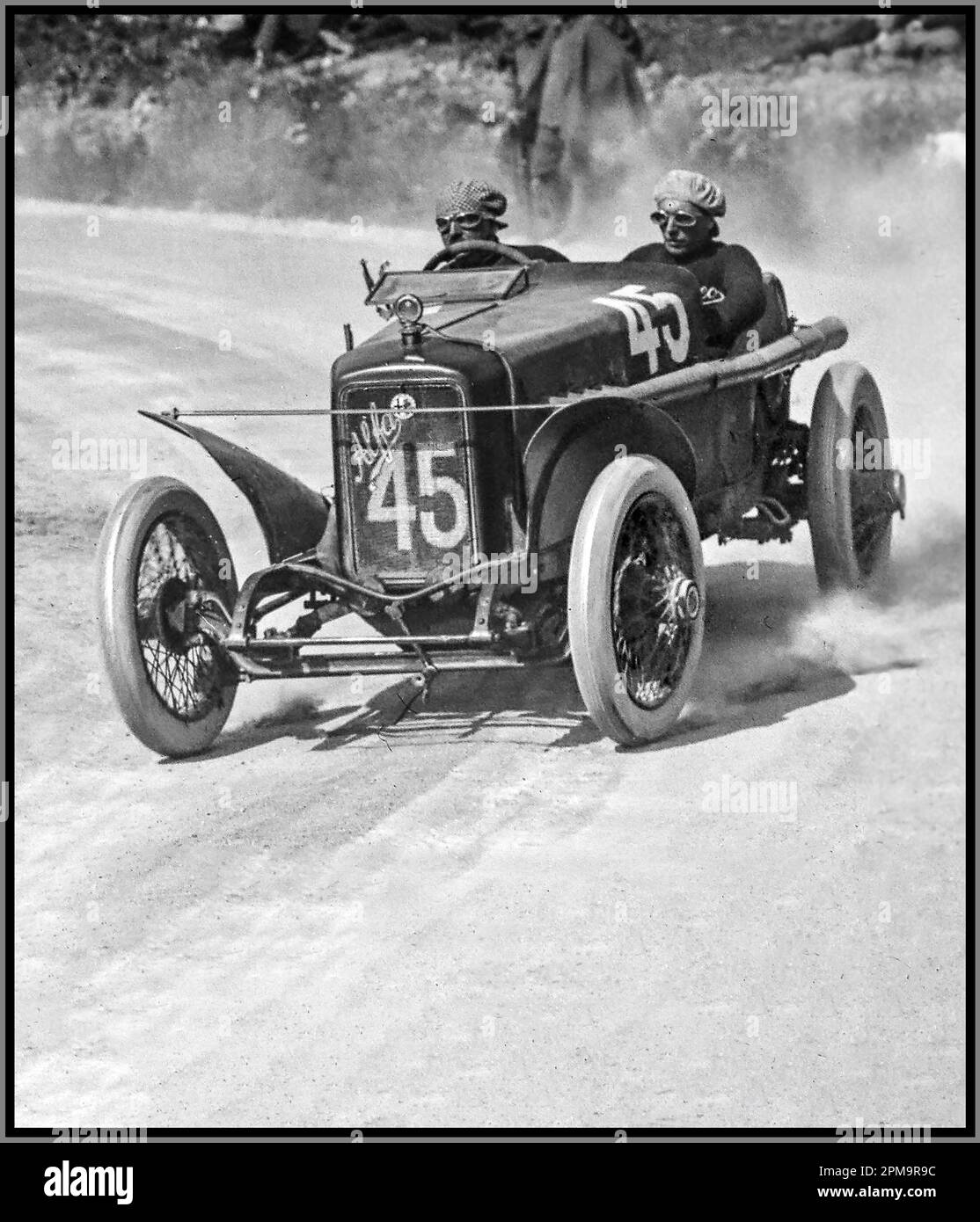 1922 Targa Florio Motor Race with Giuseppe Campari in Alfa Romeo 40-60 car number 45. The ALFA 40/60 HP is a road car and race car made by Italian car manufacturer ALFA (later to become Alfa Romeo). This model was made between 1913 and 1922 and was designed by Giuseppe Merosi, as were all other Alfas at that time. The 40/60 HP has a 6082 cc straight-four engine with overhead valves, which produced 70 PS (51 kW) and its top speed was 125 km/h (78 mph) Stock Photo