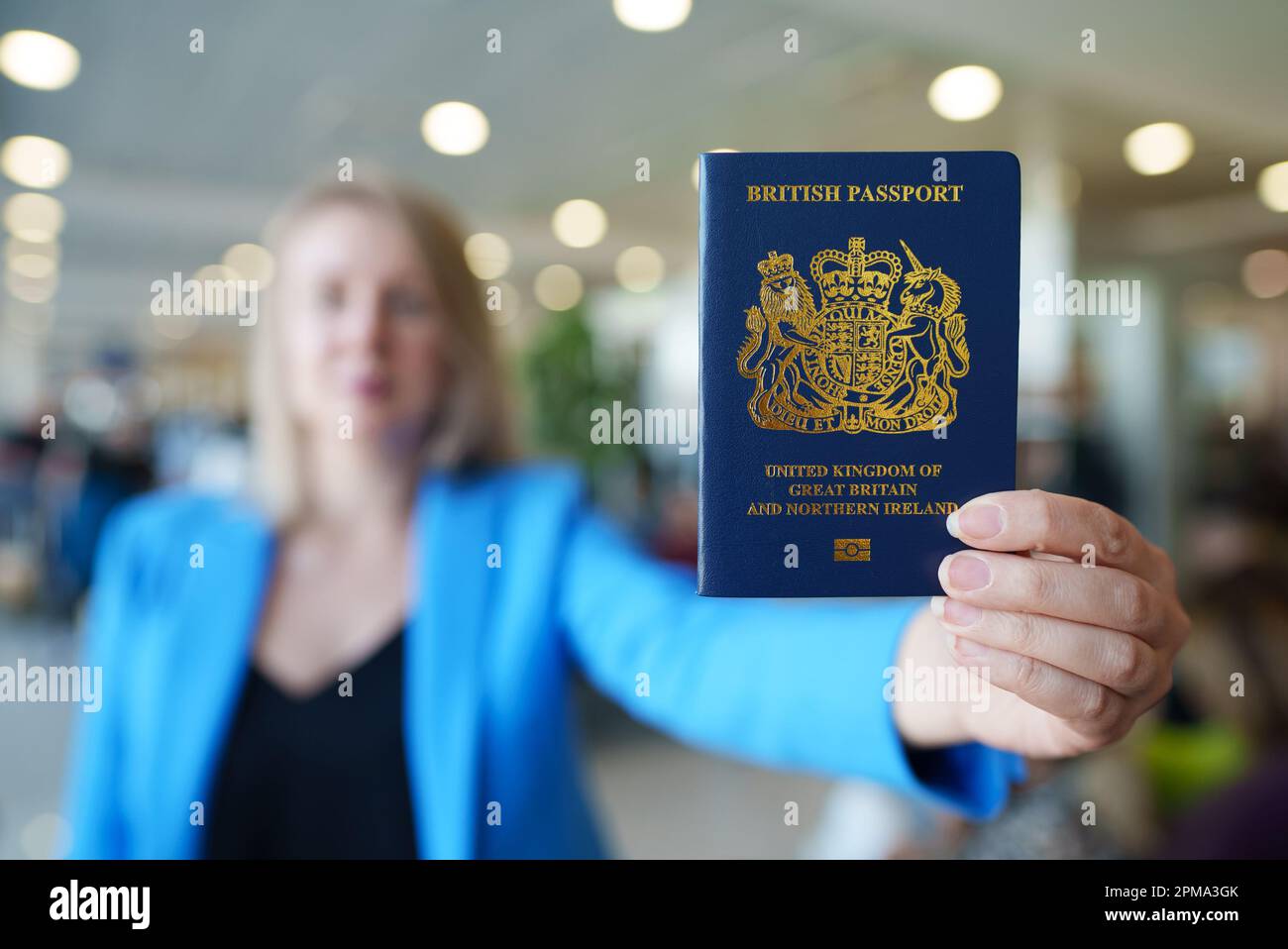 Woman showing passport of United Kingdom Stock Photo Alamy