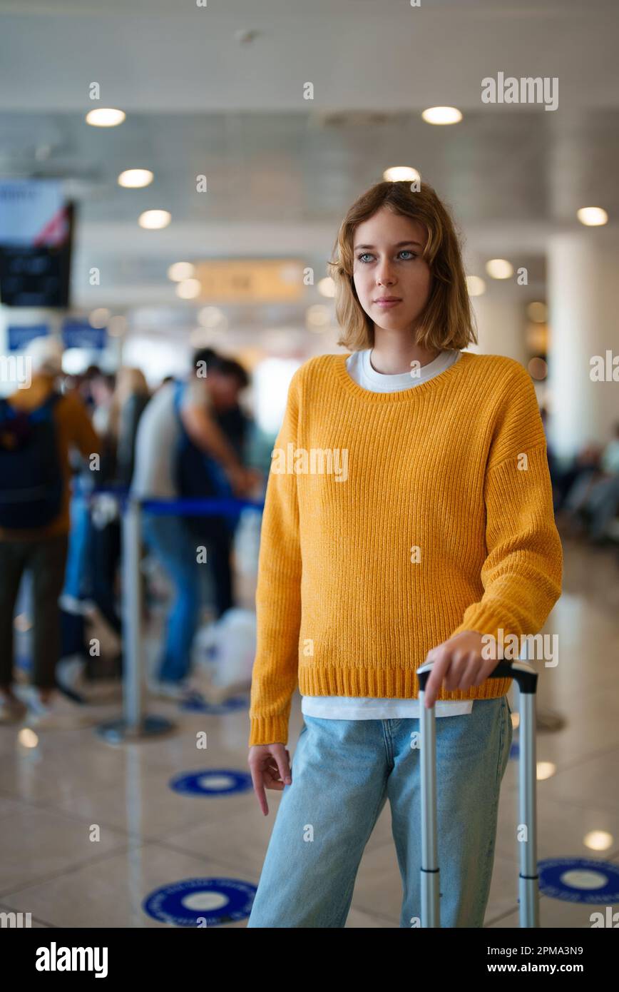 Teenage girl with luggage in airport Stock Photo Alamy