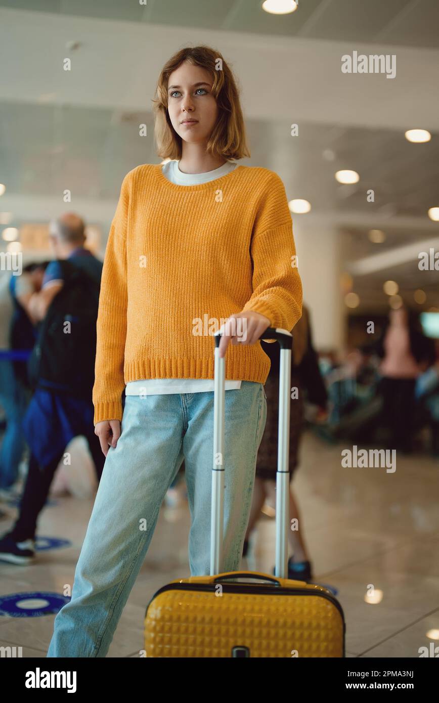 Teenage girl with luggage in airport Stock Photo Alamy