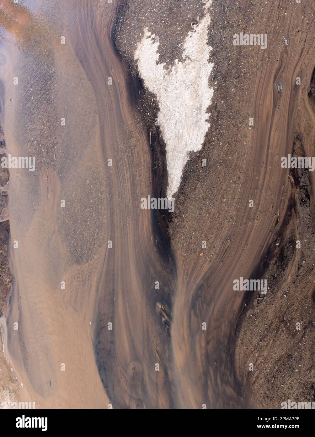 Spring melting creates interesting mud flows as gravity pulls the water