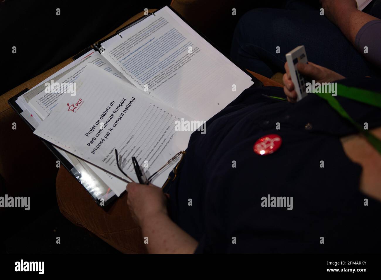 Marseille, France. 08th Apr, 2023. A member of the communist party studies the text before voting. The 39th Congress of the French Communist Party (PCF) takes place in Marseille from 7 to 10 April 2023. It reappoints Fabien Roussel as its leader. (Photo by Laurent Coust/SOPA Images/Sipa USA) Credit: Sipa USA/Alamy Live News Stock Photo
