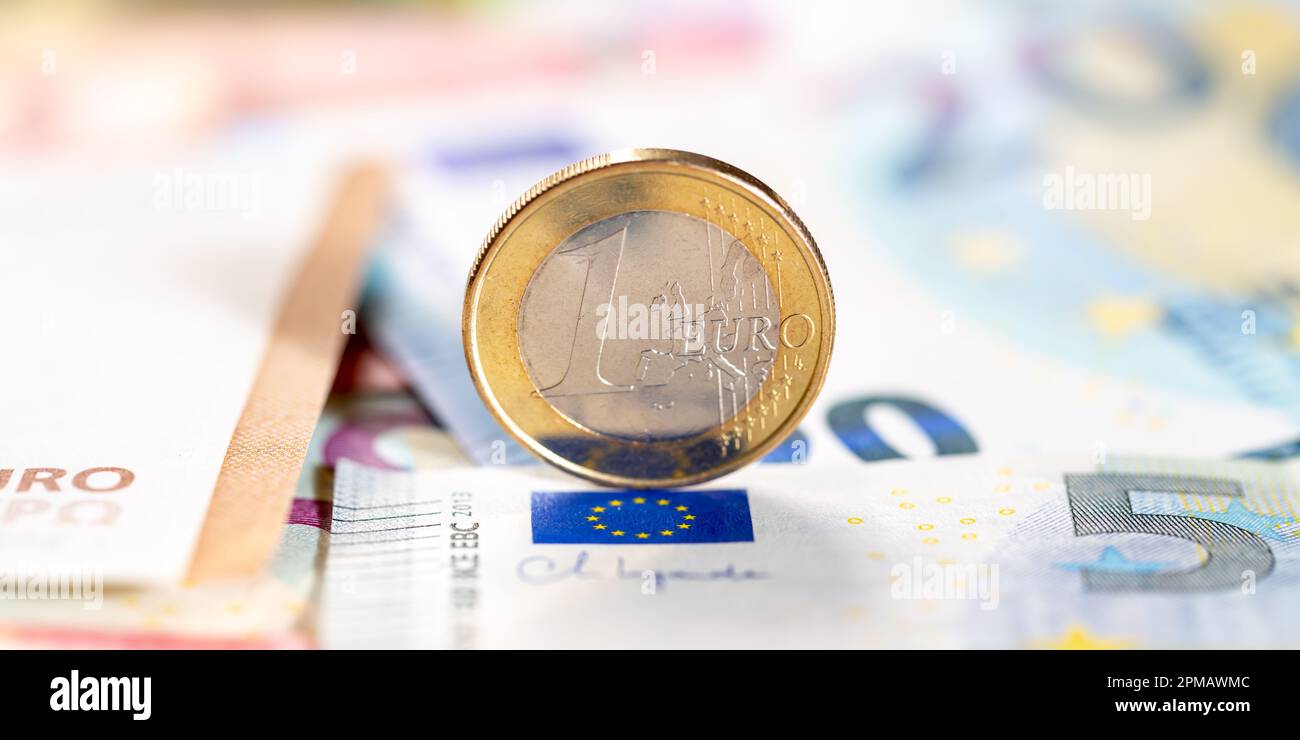 One Euro coin money saving pay paying finances banner with copyspace copy space rich Stock Photo