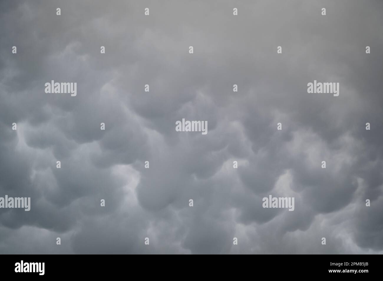 Orwell, Cambridgeshire, UK. 12th Apr, 2023. Mammatus clouds fill the sky over the Church of the