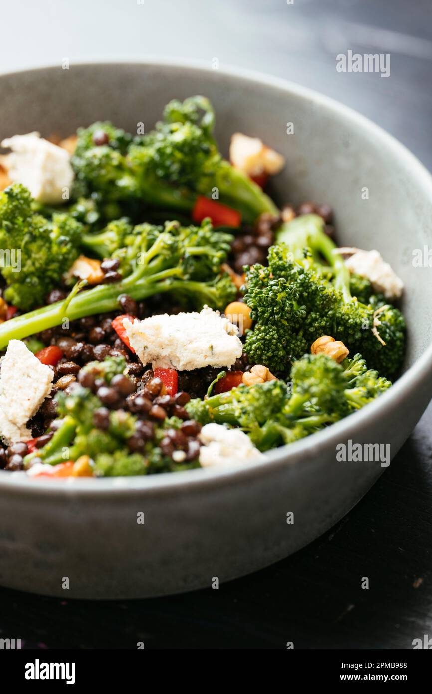 Marinated lentils with broccoli and vegan feta Stock Photo Alamy
