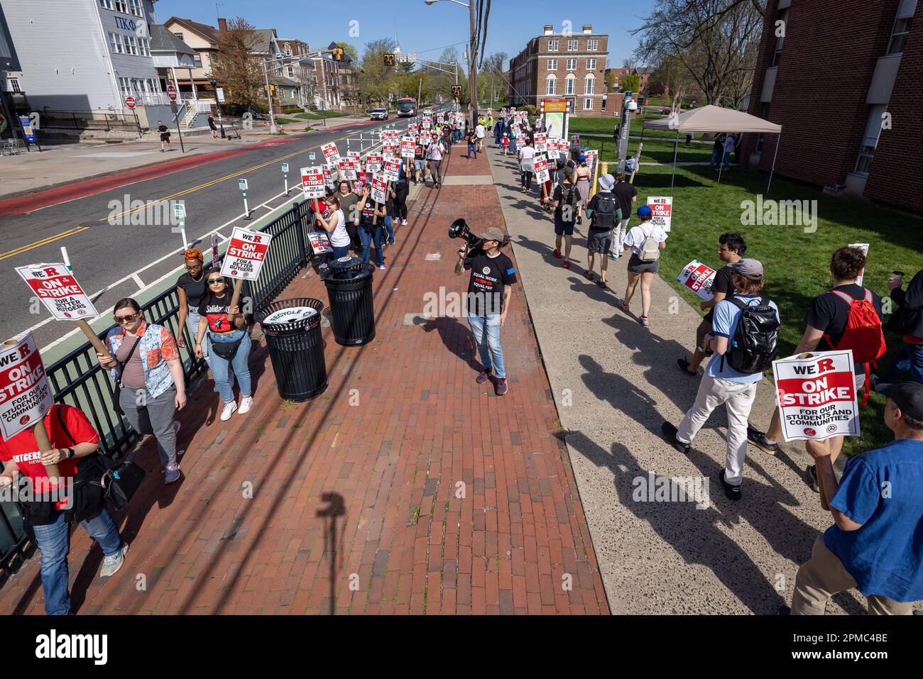 NEW BRUNSWICK, NEW JERSEY APRIL 12 A protester with a bullhorn leads