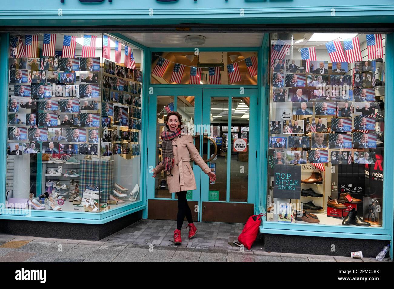 Kelsey Donnelly stands outside her father's store that was decorated to