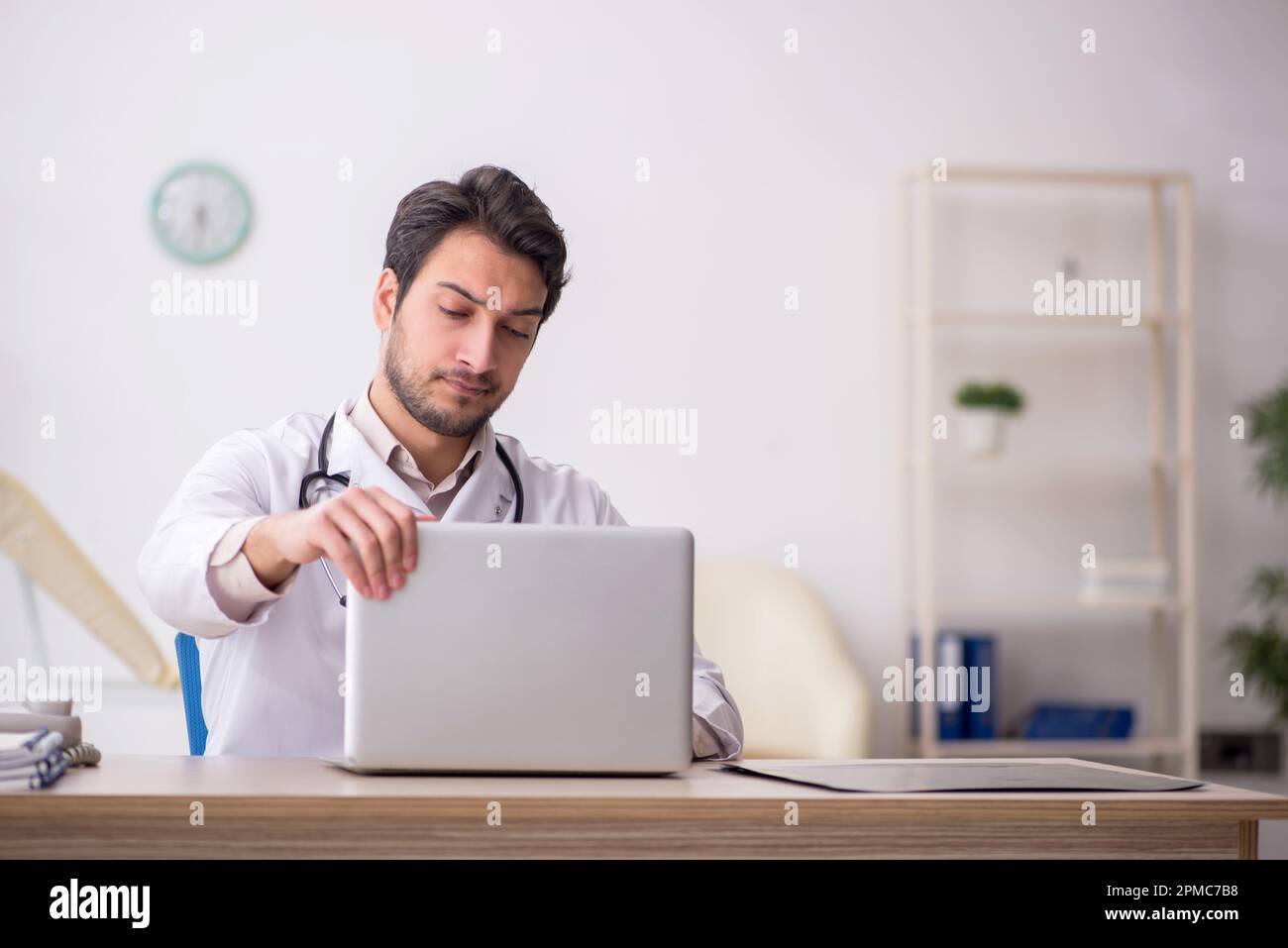 Young doctor in telemedicine concept Stock Photo