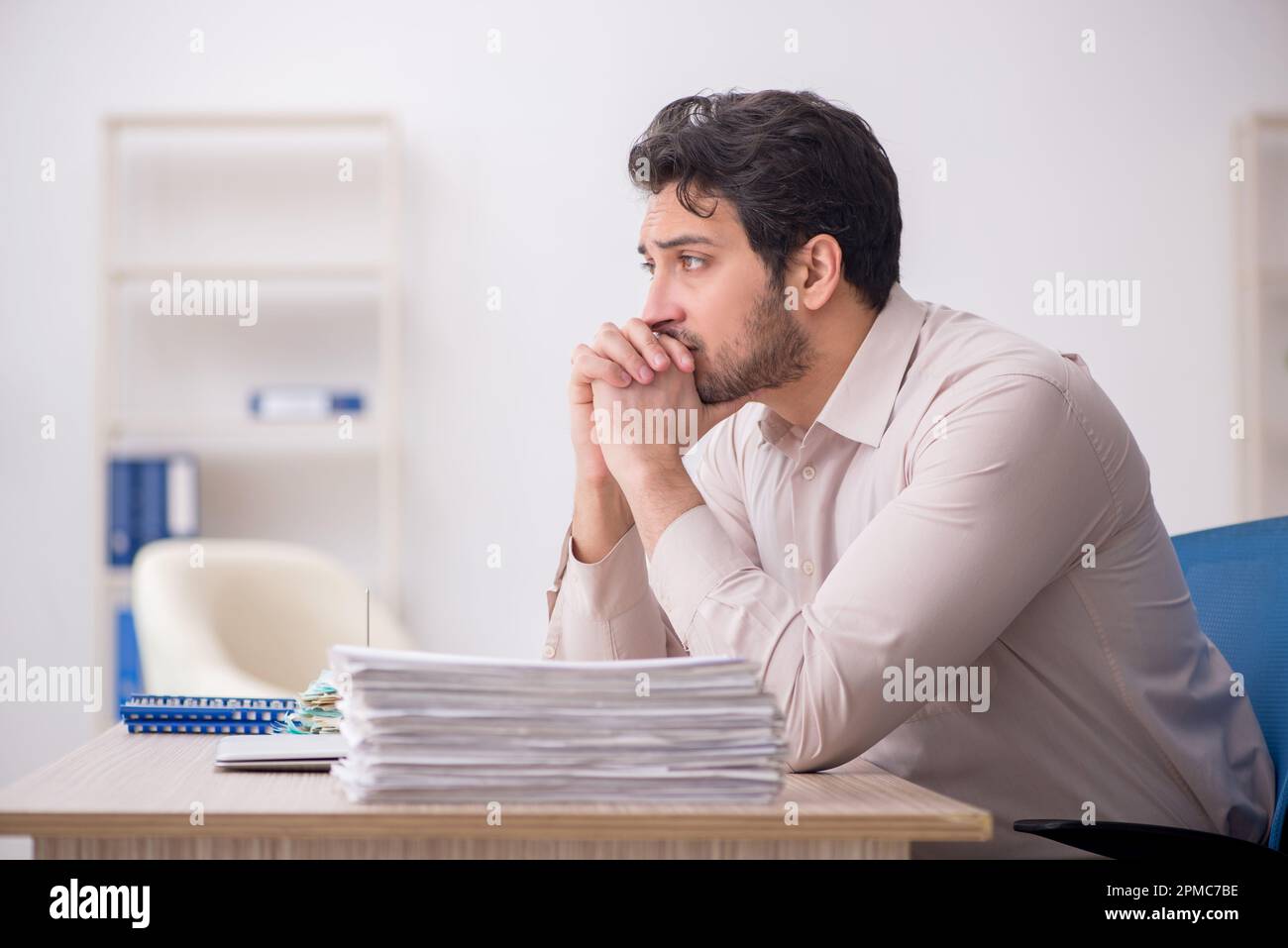 Young accountant sitting at workplace Stock Photo