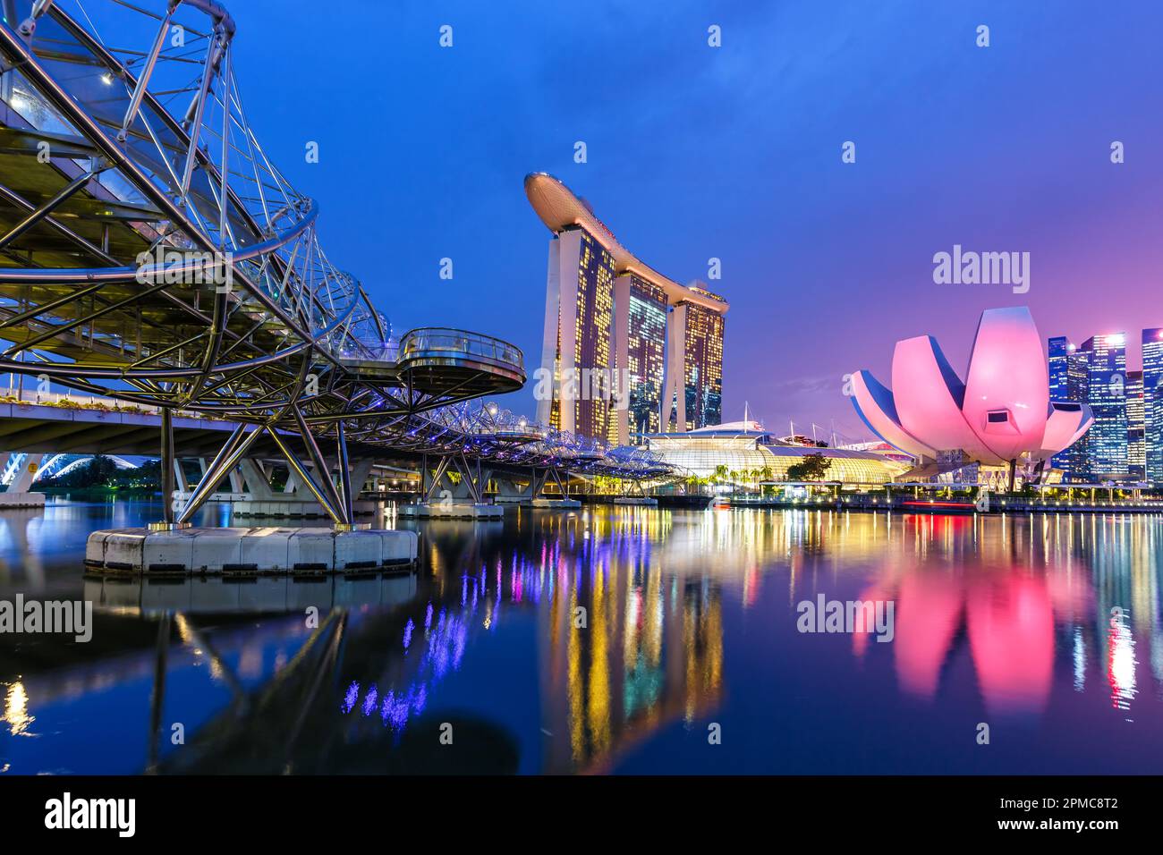 Marina Bay Skyline and Helix Bridge landmark at twilight in Singapore Stock Photo
