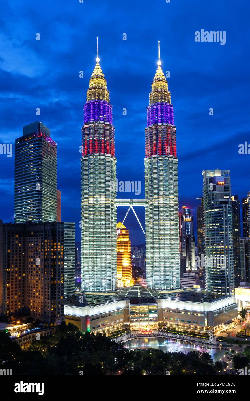 Petronas Twin Towers skyscrapers KLCC skyline at twilight landmark portrait format in Kuala Lumpur Malaysia Stock Photo