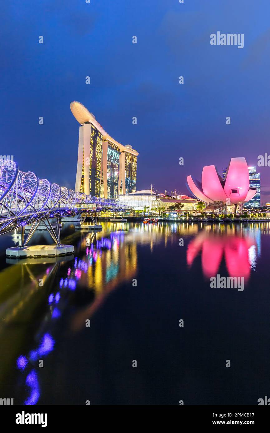 Marina Bay Skyline and Helix Bridge landmark portrait format at twilight in Singapore Stock Photo