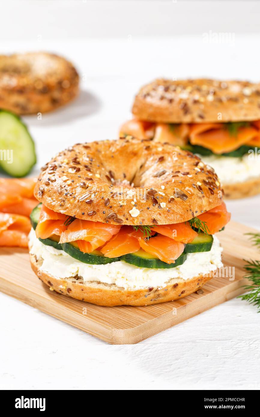 Bagel sandwich with salmon fish and cream cheese for breakfast portrait format Stock Photo