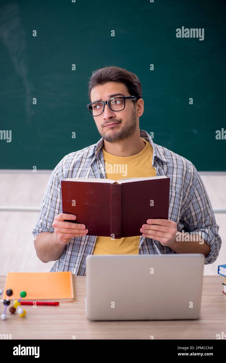 Young student sitting in the classroom Stock Photo - Alamy