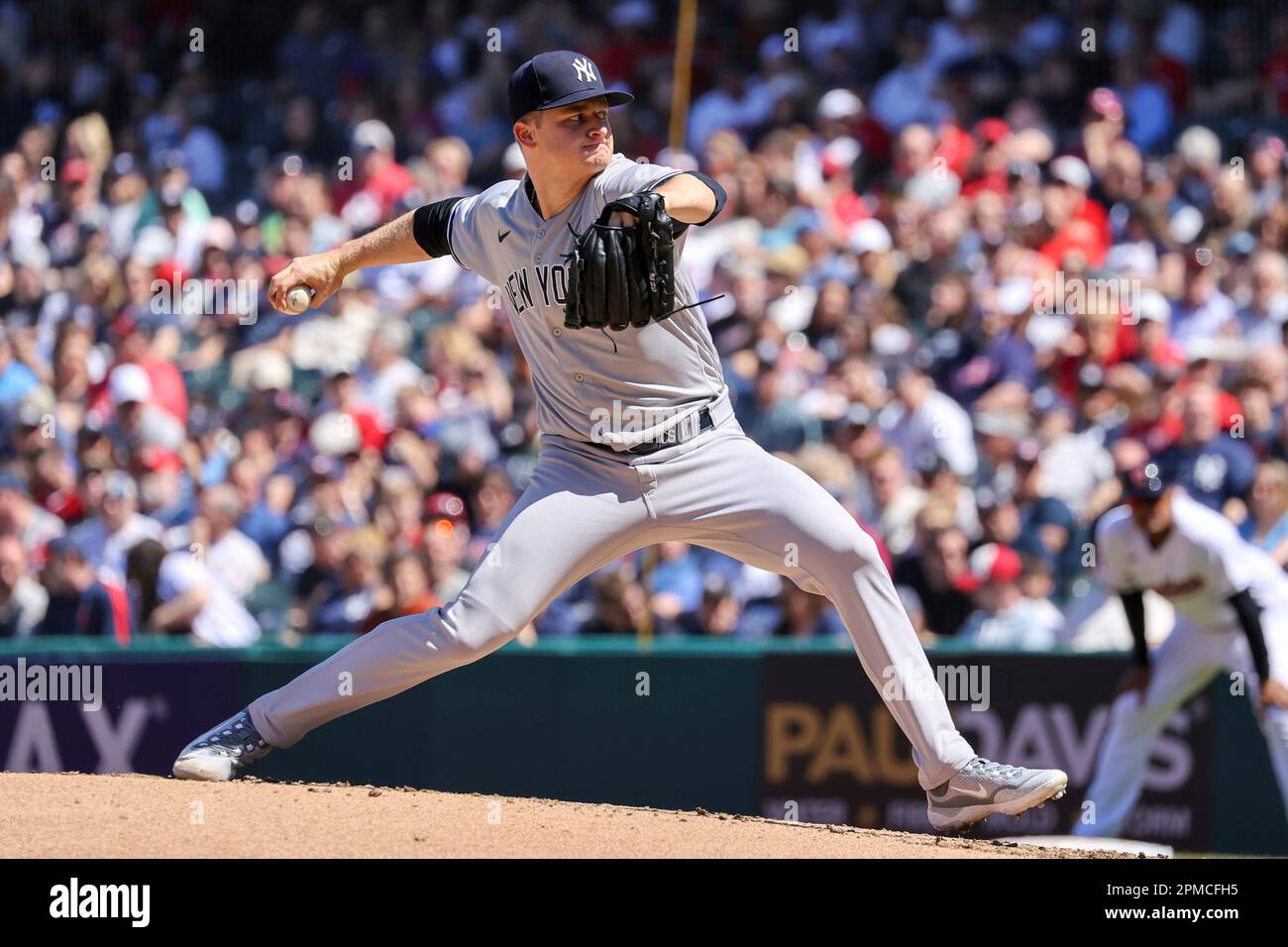 CLEVELAND, OH - APRIL 12: New York Yankees shortstop Anthony Volpe (11)  makes the catch for an out during the eighth inning of the the Major League  Baseball game between the New