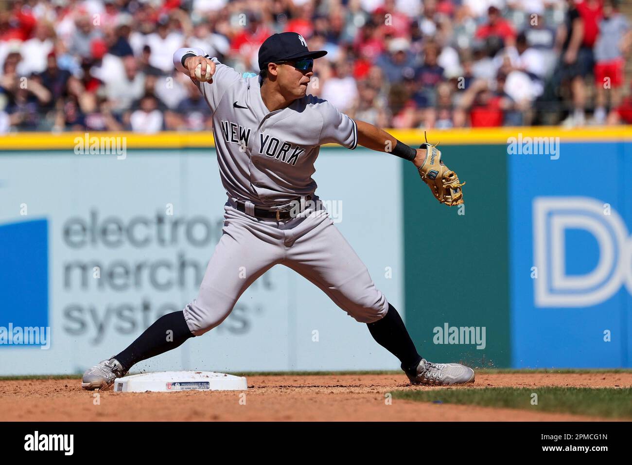 CLEVELAND, OH - APRIL 12: New York Yankees shortstop Anthony Volpe (11)  makes the catch for an out during the eighth inning of the the Major League  Baseball game between the New