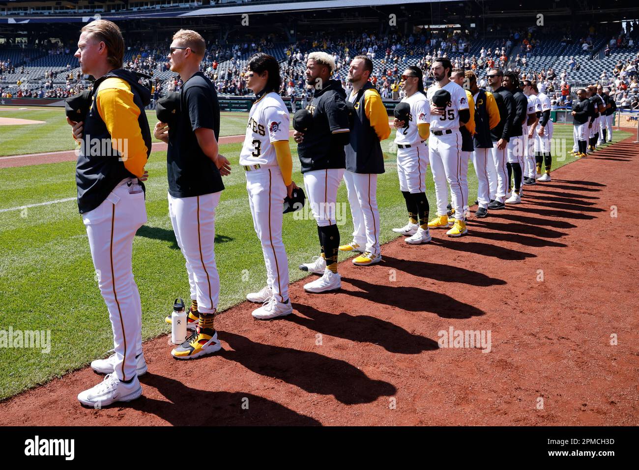 PITTSBURGH, PA - APRIL 12: Pittsburgh Pirates players line up for the  National Anthem prior to an MLB game against the Houston Astros on April  12, 2023 at PNC Park in Pittsburgh