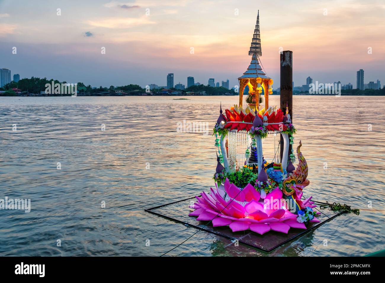 Floating altar in the Chao Phraya River during the Loi Krathong festival in Bangkok, Thailand Stock Photo