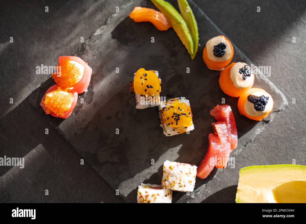 Close up of tasty japanese uramaki sushi with salmon Stock Photo