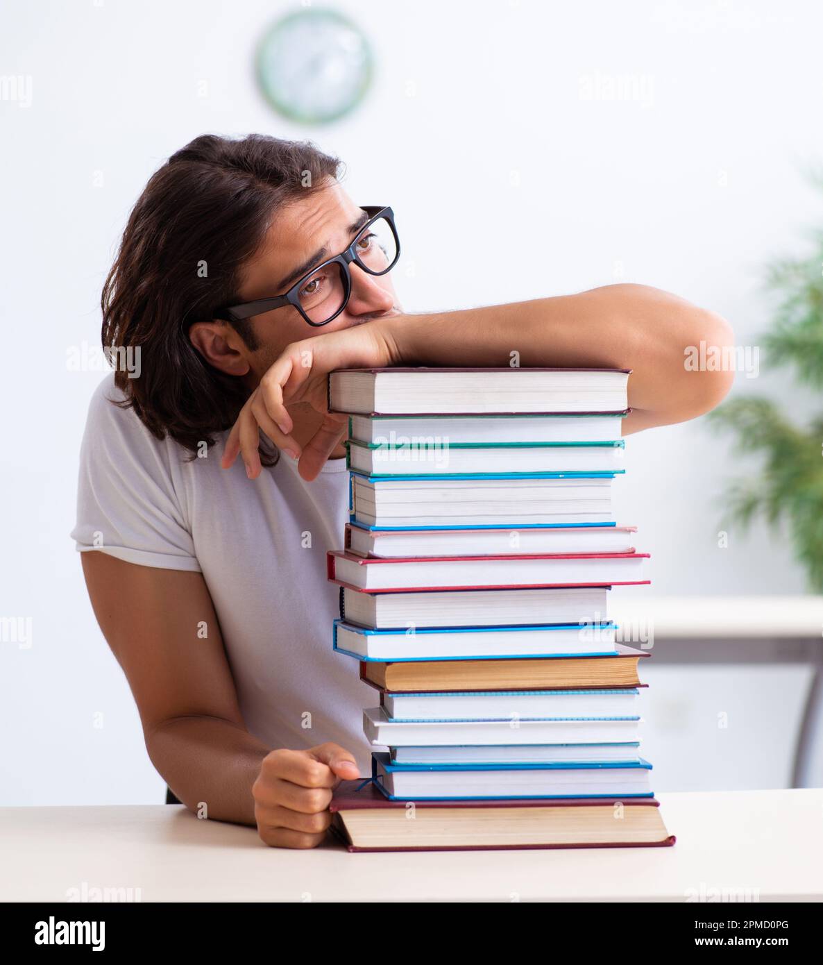 The young male student sitting in the classroom Stock Photo - Alamy