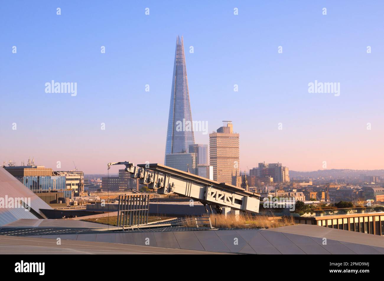 Elevated view of the Shard building skyscraper next to Guy's Tower at Guy's Hospital from the rooftop terrace of One New Change, London, England, UK. Stock Photo