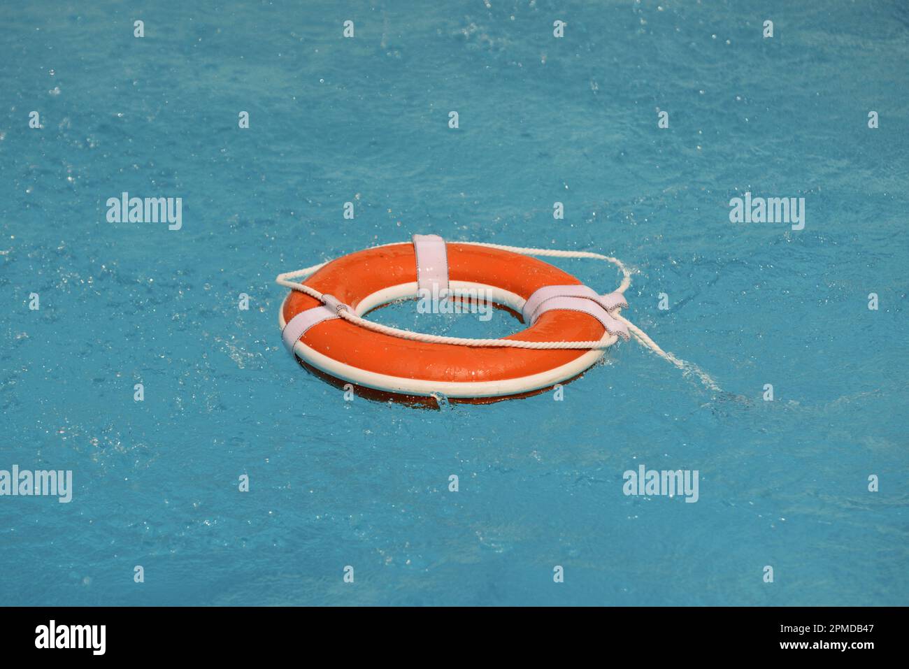 No swimming. Water rescue emergency equipment. Rescue ring floating in ...