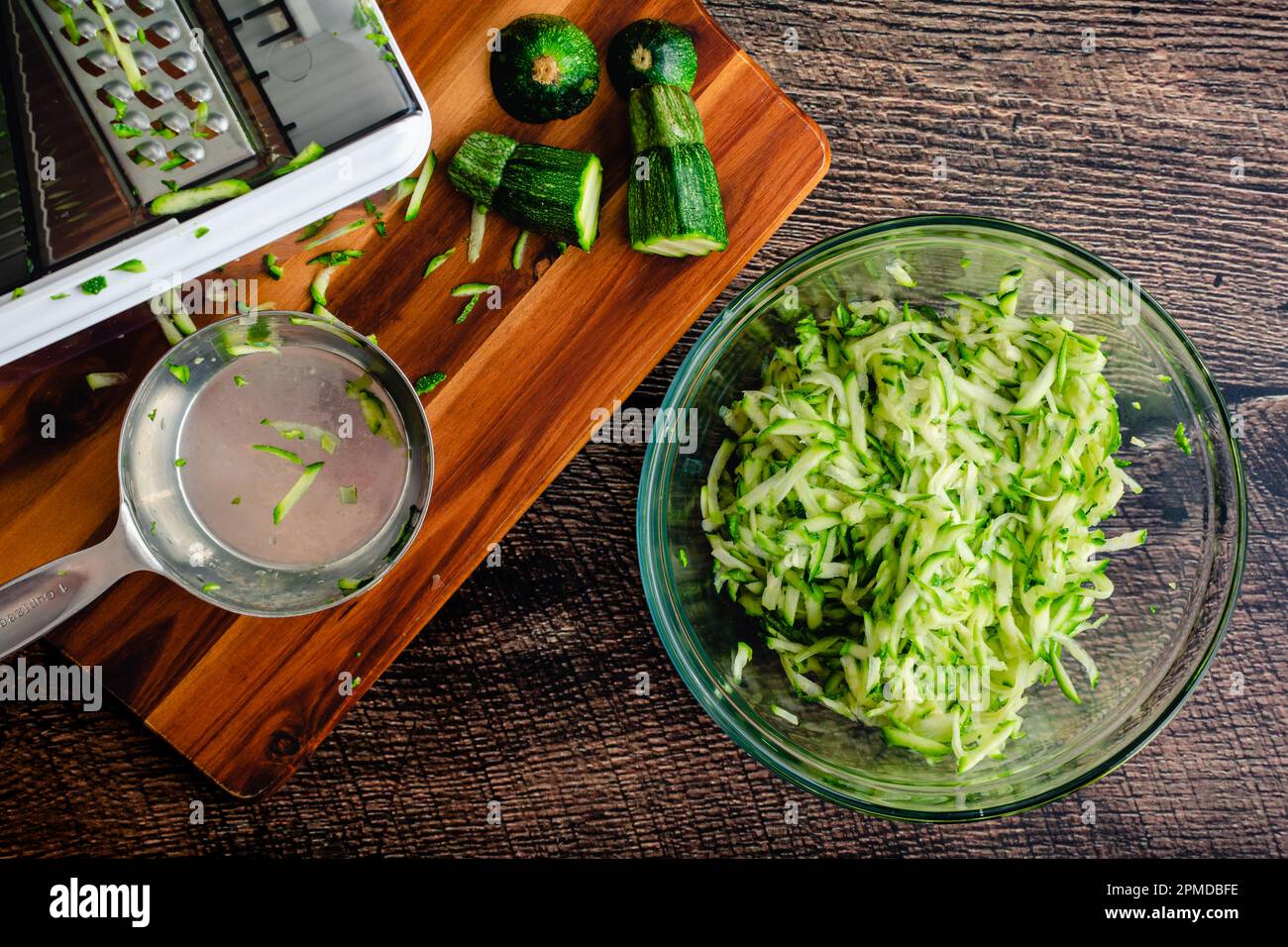 Shredded Zucchini in a Glass Mixing Bowl Grated zucchini shown with a