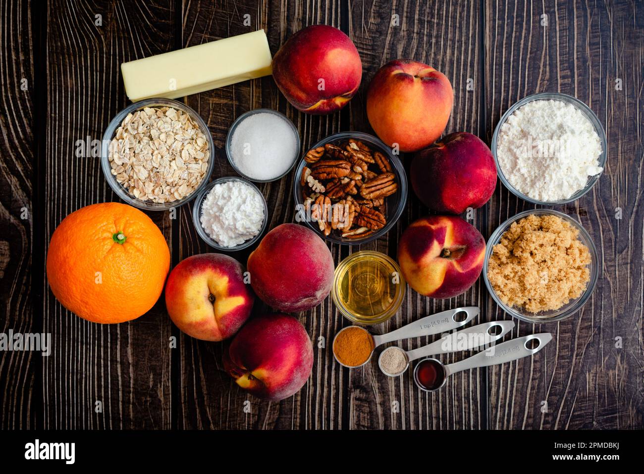 Bourbon Pecan Peach Crisp Ingredients on a Wood Table Fresh peaches