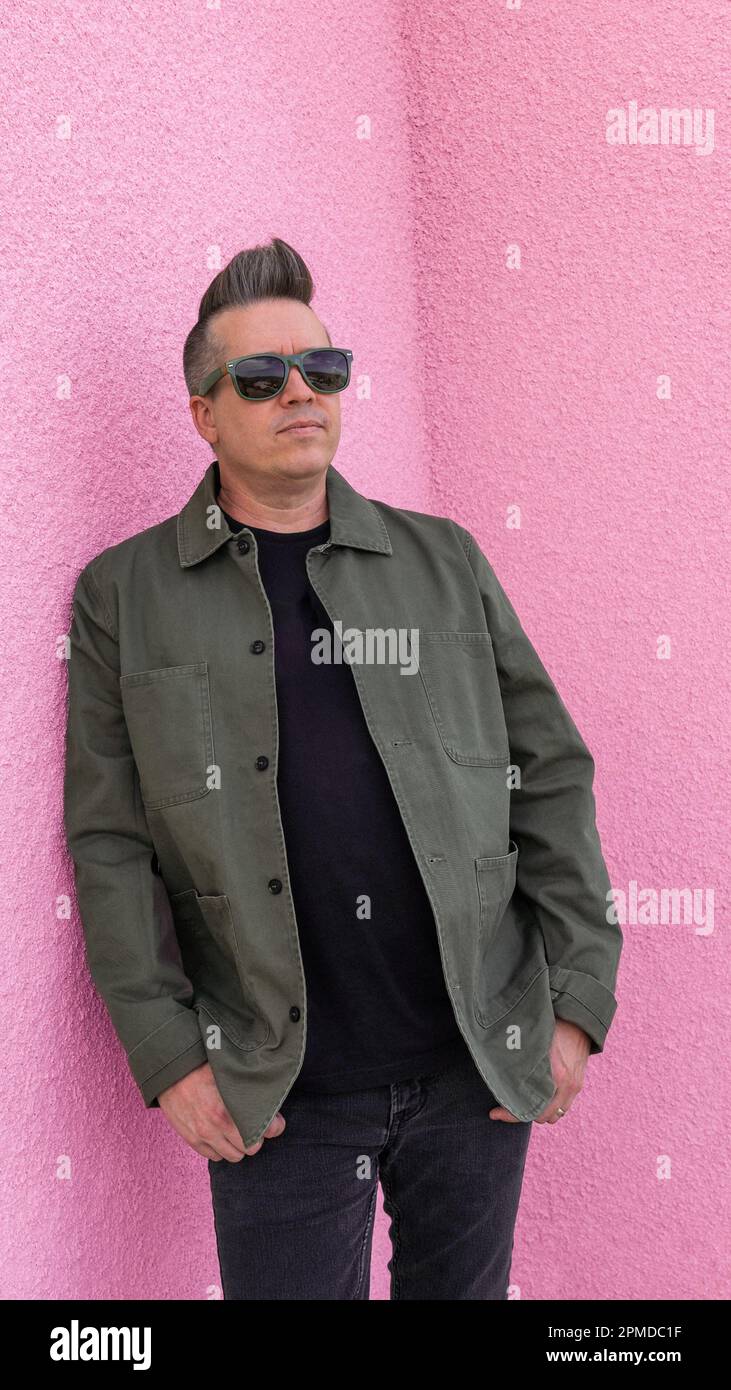 Person wearing green jacket hi-res stock photography and images - Alamy