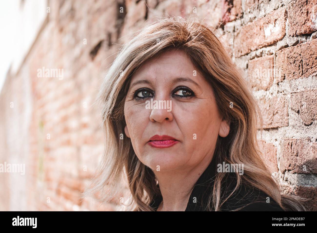 Pensive thoughtful middle aged woman looking away. Stock Photo