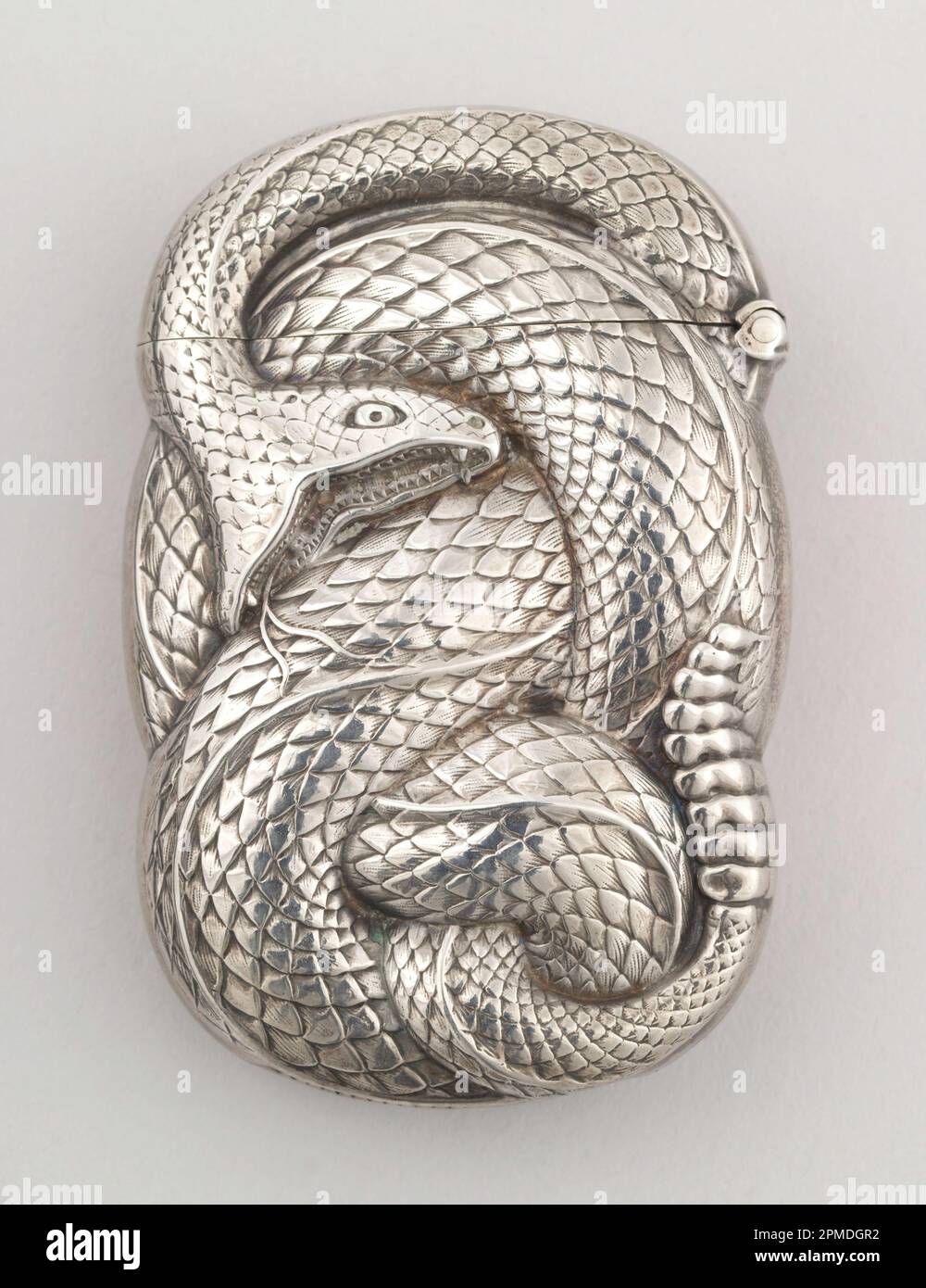 Coiled Rattlesnake Matchsafe; Manufactured by William B. Kerr & Company (United States); USA; silver; 6.7 x 4.3 x 1.5 cm (2 5/8 x 1 11/16 x 9/16 in. ) Stock Photo