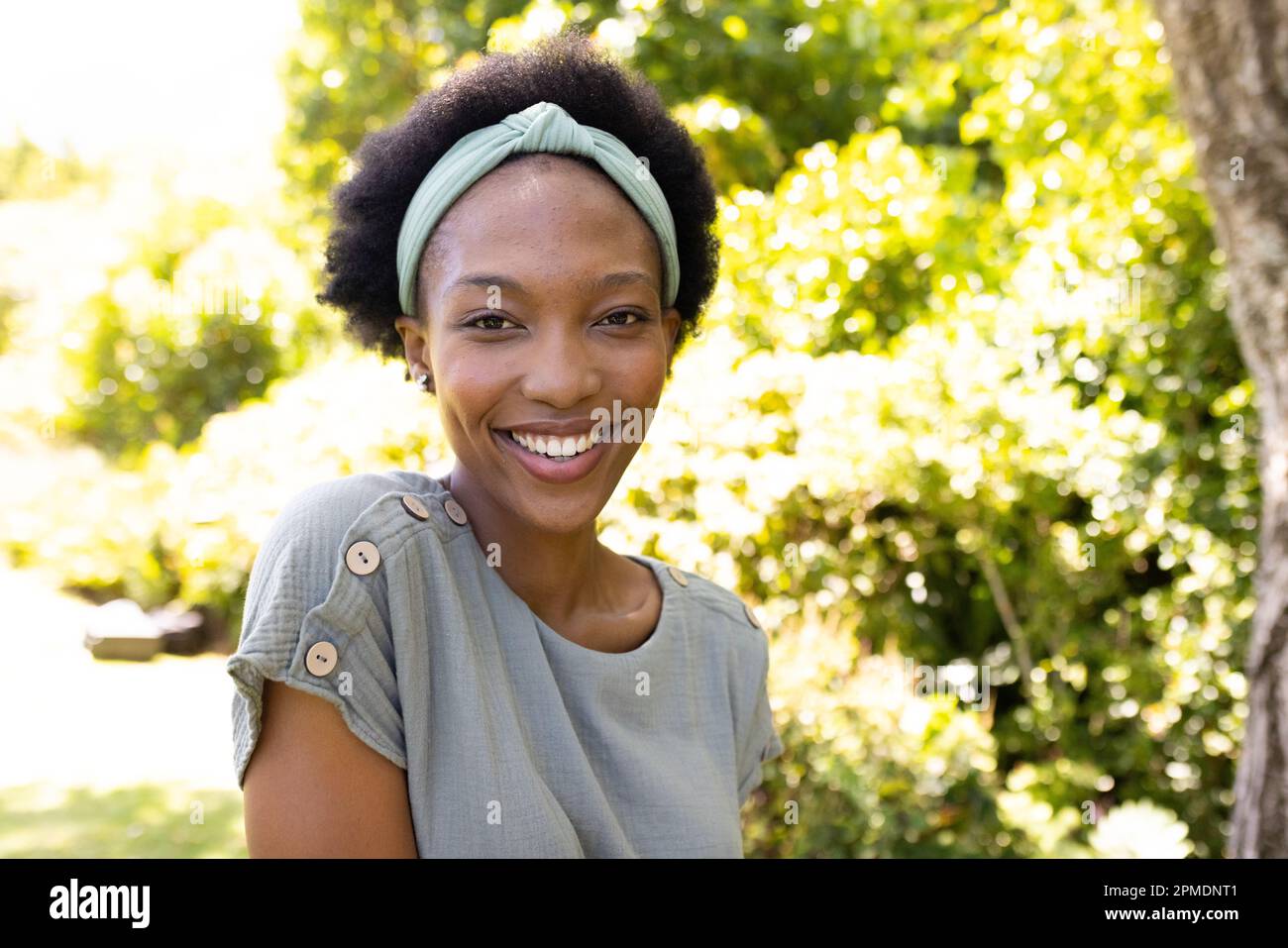  Portrait of smiling african american mid adult woman with short afro ...