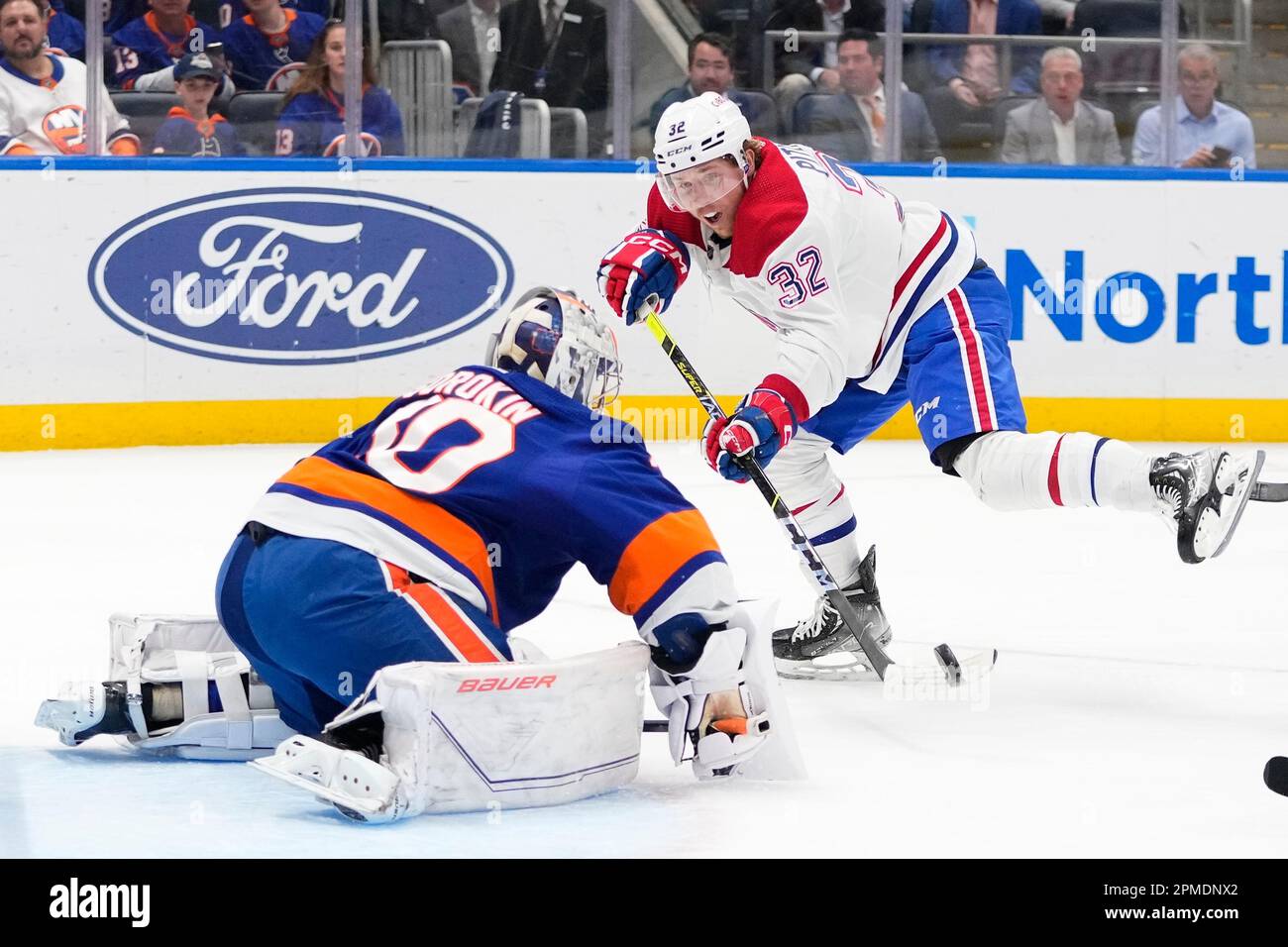Montreal Canadiens' Rem Pitlick (32) attempts to score as New York