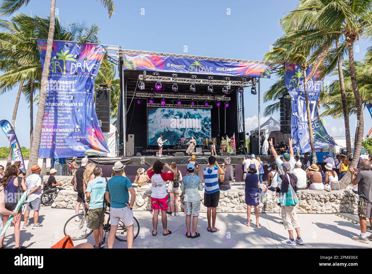 Miami Beach Florida,Miami Beach Live Carnaval Experience,Spring Break Breakers,Lummus Park,watching free concert stage singer band musicians performin Stock Photo