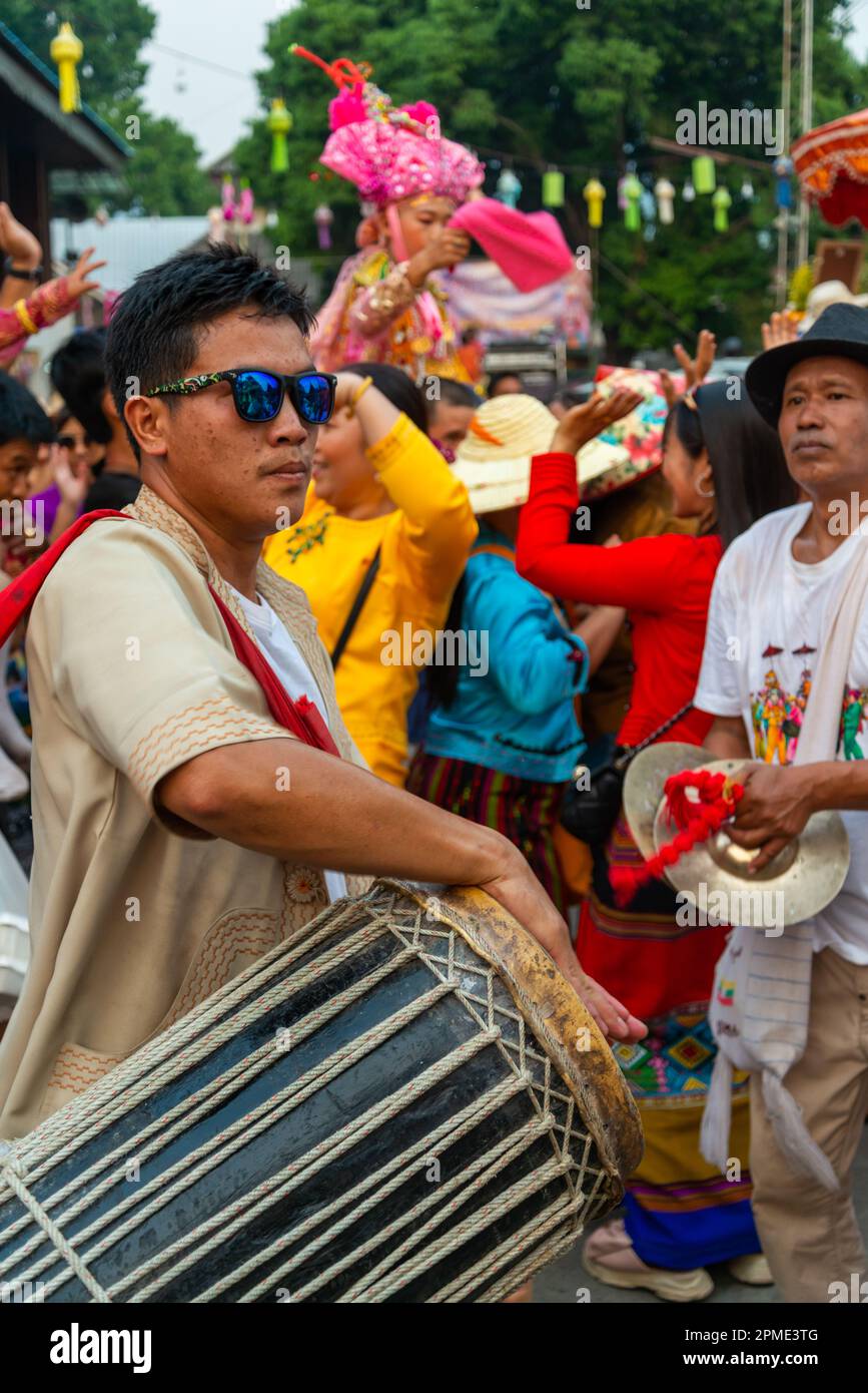 Pai,Northern Thailand-April 4th 2023: Super energetic post Covid festivities abound in the passing crowd,at the colorful Buddhist festival,where boys Stock Photo
