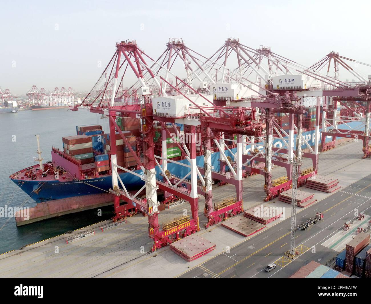 QINGDAO, CHINA - APRIL 13, 2023 - A cargo ship loads cargo at the ...