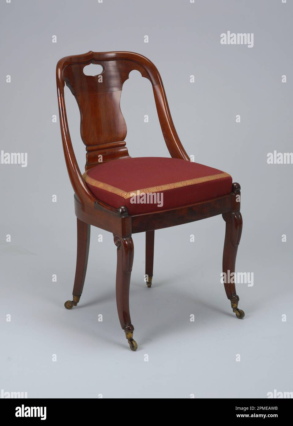 Side Chair (USA); mahogany veneered oak and ash (frame), solid mahogany (legs, arms, and back), brass (coasters) Stock Photo