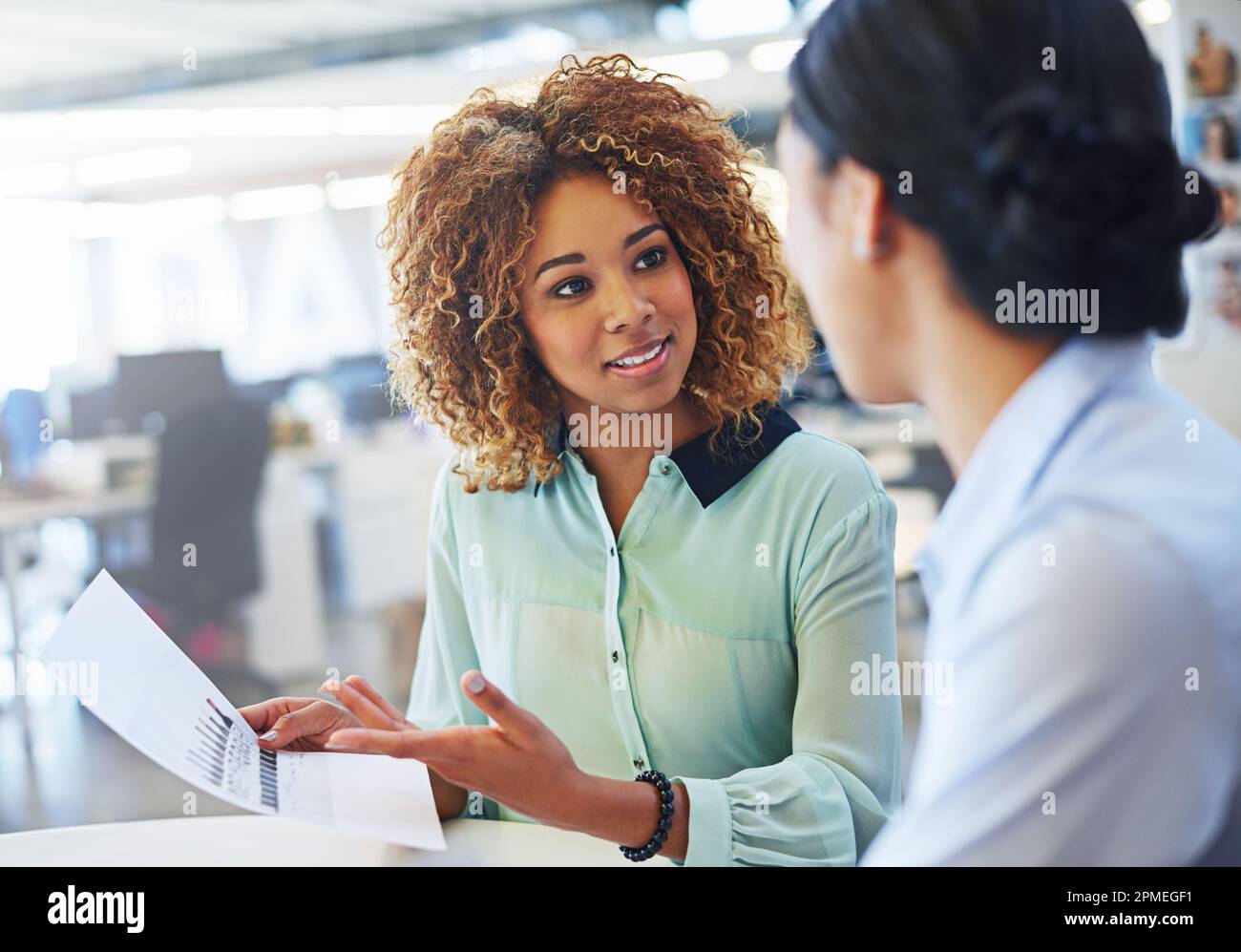 This is some concise work. two businesswoman working together in an office. Stock Photo