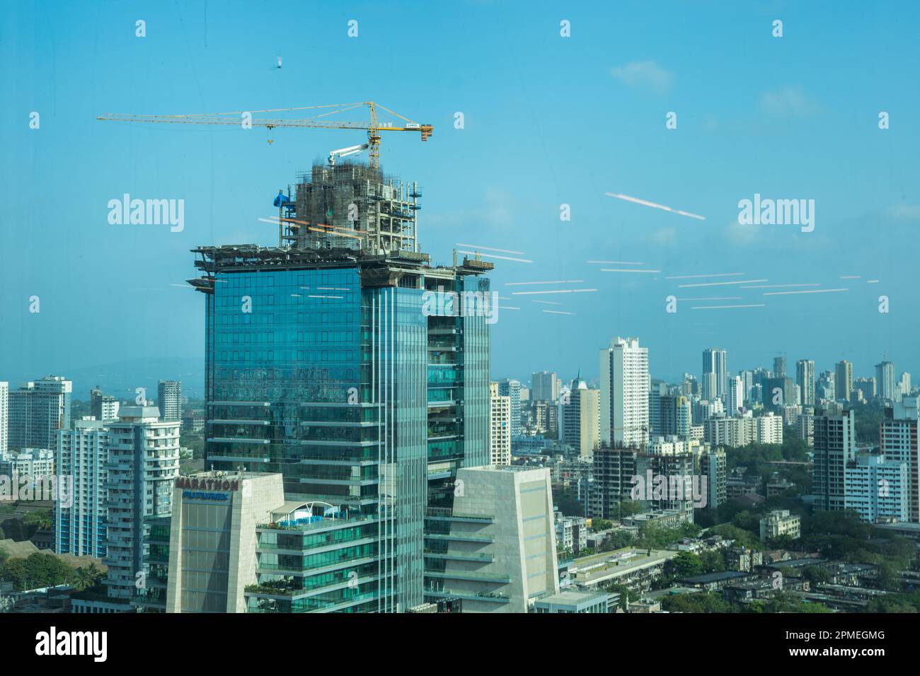 Aerial panoramic view of a building in construction at Mumbai's richest business district and skyscraper hub - Lower Parel. Stock Photo