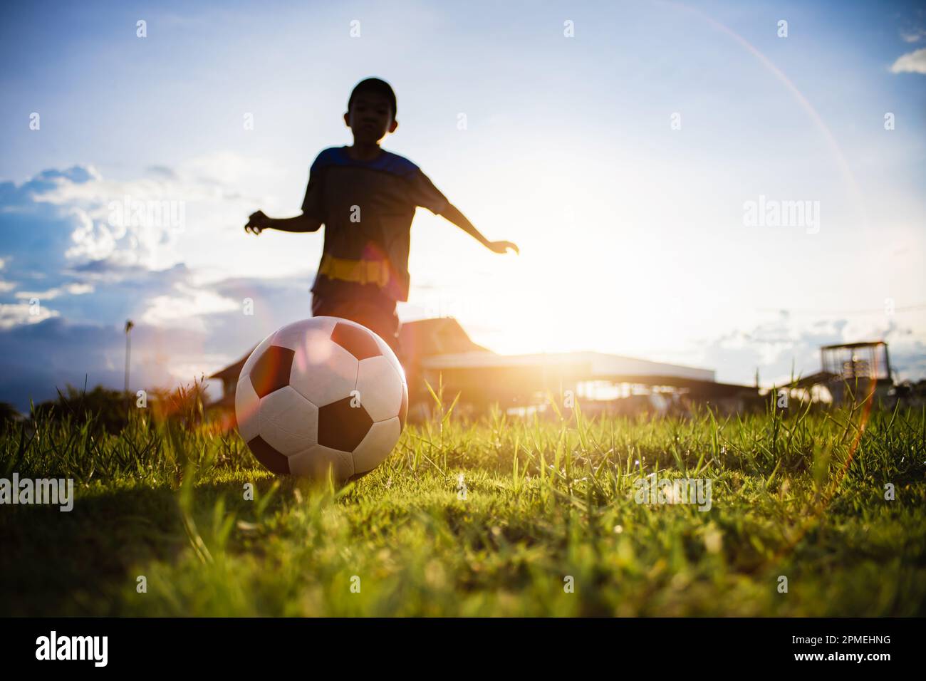 action sport outdoors of a group of kids having fun playing soccer