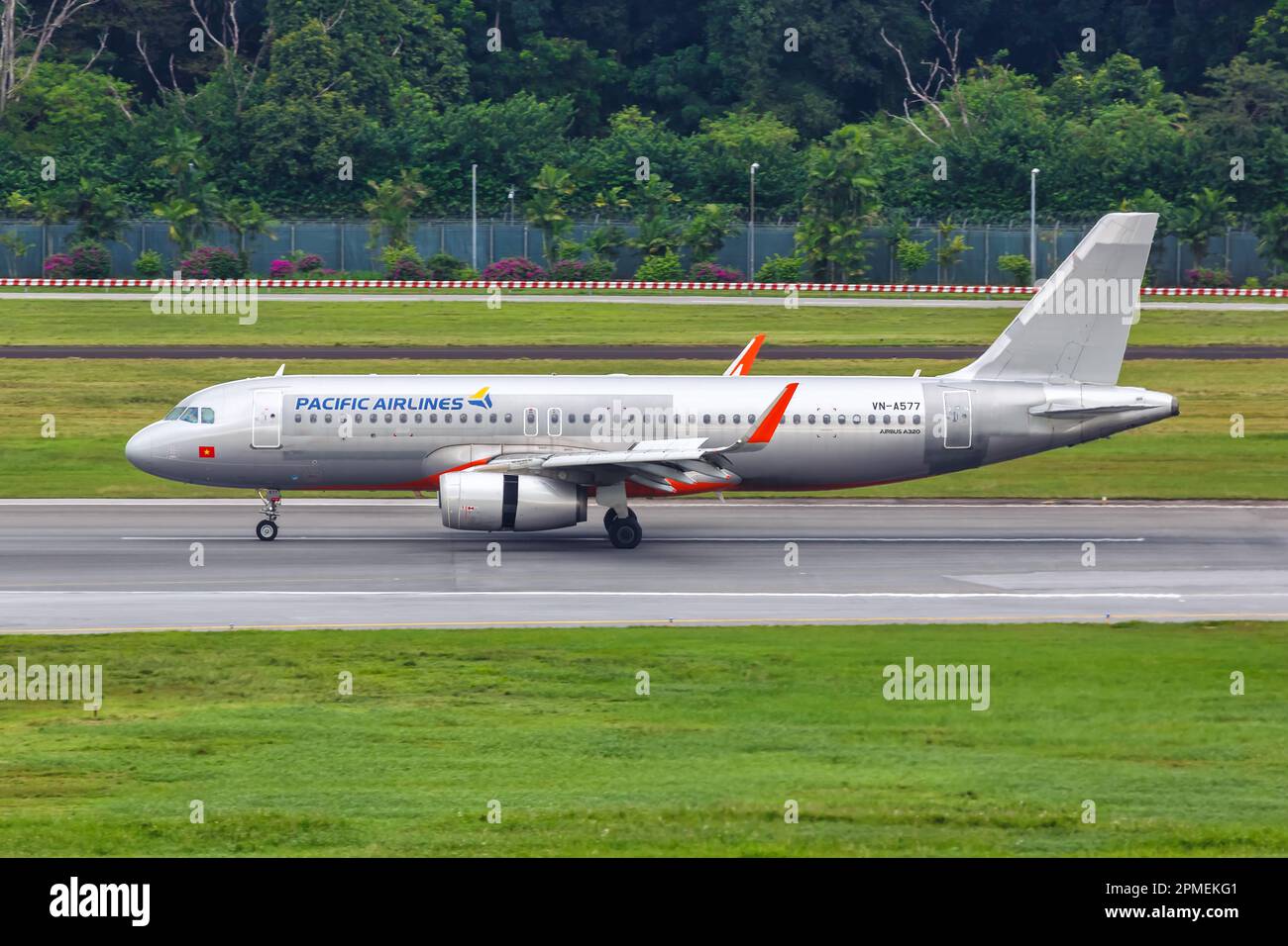 Changi, Singapore - February 3, 2023: Pacific Airlines Airbus A320 airplane at Changi Airport (SIN) in Singapore. Stock Photo