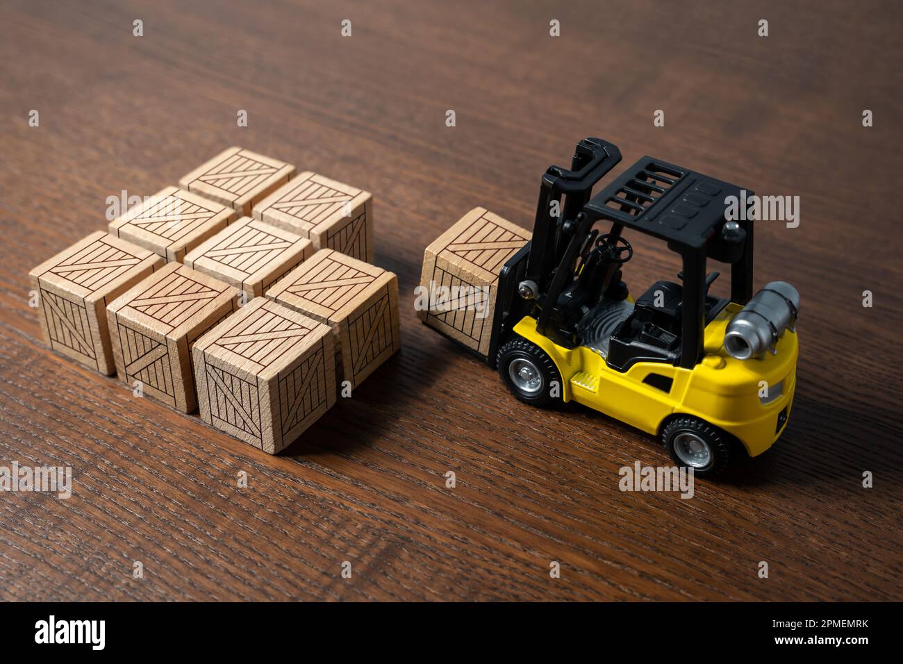 A forklift transports and places boxes. Order for shipment. Production and freight of goods. Increase in imports and exports. The work of the transpor Stock Photo