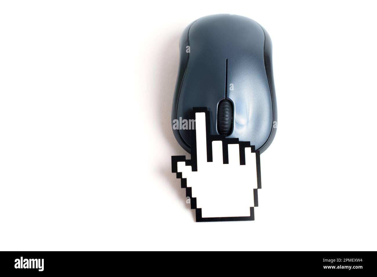 Handshaped cursor figurine clicks a computer mouse button. Creative