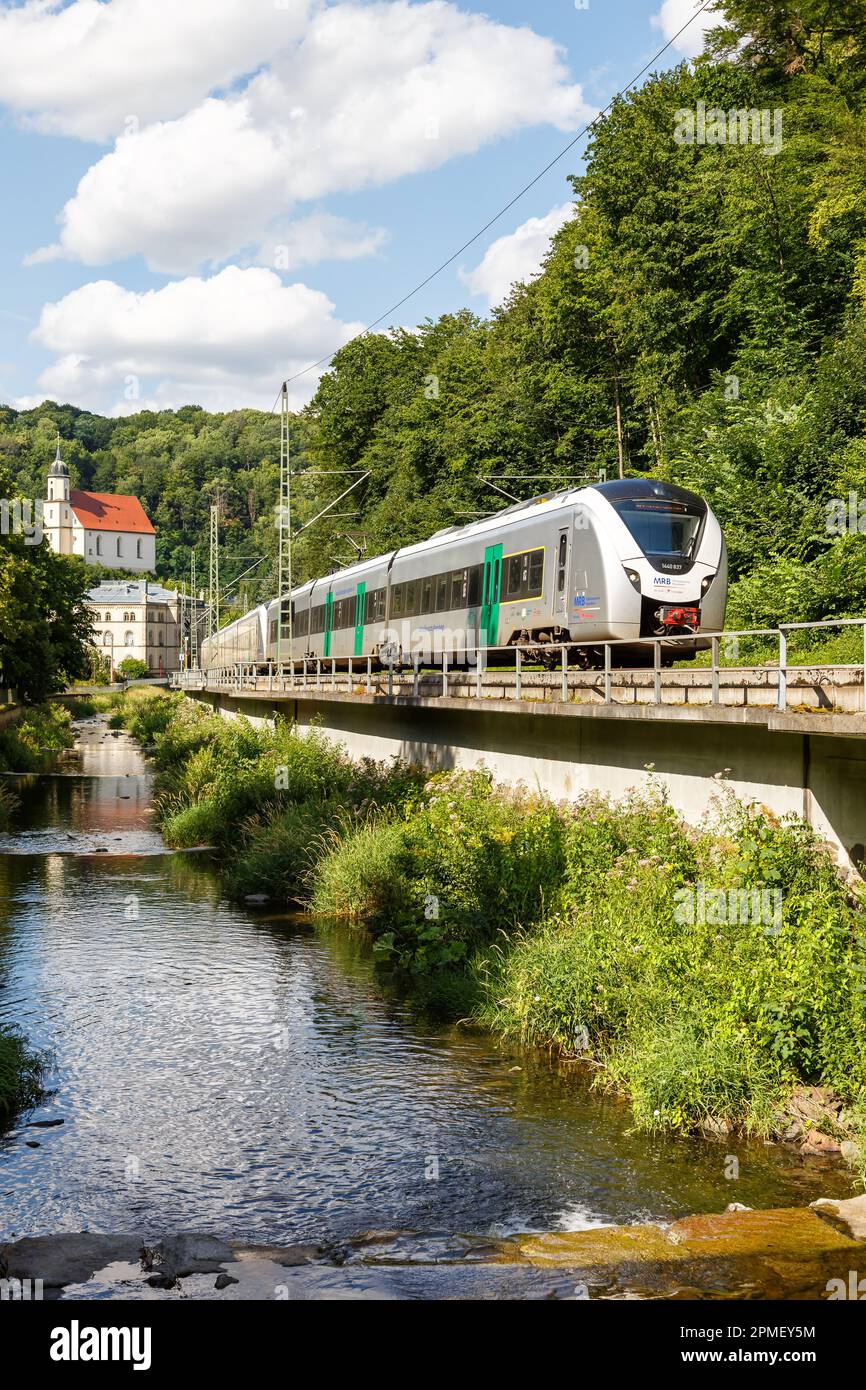 Tharandt, Germany – July 31, 2021: Regional train Alstom Coradia Continental for Mitteldeutsche Regiobahn MRB portrait format in Tharandt, Germany. Stock Photo