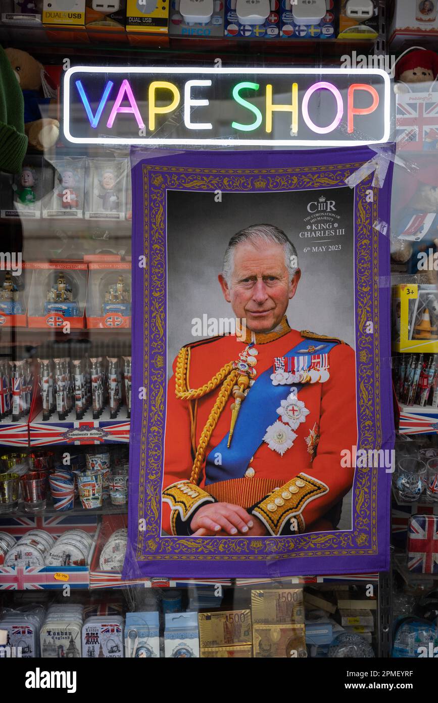 Souvenir shop in London selling King Charles III Coronation tea towel,  advertised under the Vape Shop sign in a high street shop window, London,  UK Stock Photo - Alamy