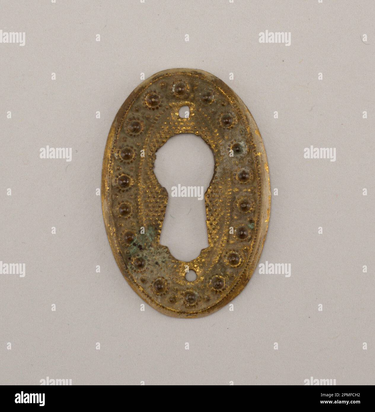 Escutcheon; brass; L x W: 4.3 × 2.9 cm (1 11/16 × 1 1/8 in.); 1931-34-6 Stock Photo