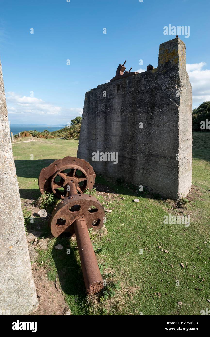 Creigiau Rhiwledyn or Little Ormes Head on the North Wales coast view looking at the Old Quarry pulley winch gear near Porth Dyniewaid Stock Photo