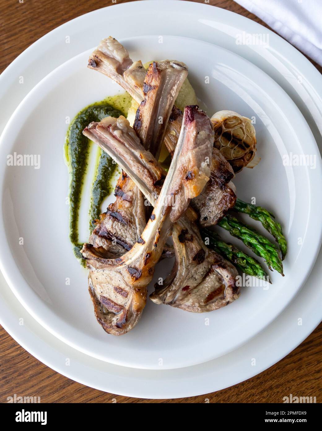 Grilled lamb chops with green herb sauce and asparagus. Lamb chops with