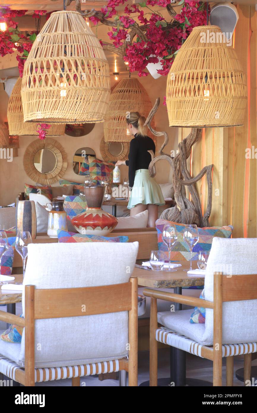 France, Var, Saint Tropez, Quai Jean Jaures, port, La Petite Plage  restaurant with its menu designed by Eric Frechon, waitress setting a table  Stock Photo - Alamy